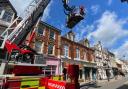 Firefighters raise bunting on Wood Street