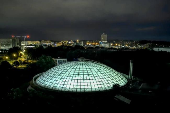 The Oasis dome glowing in the night