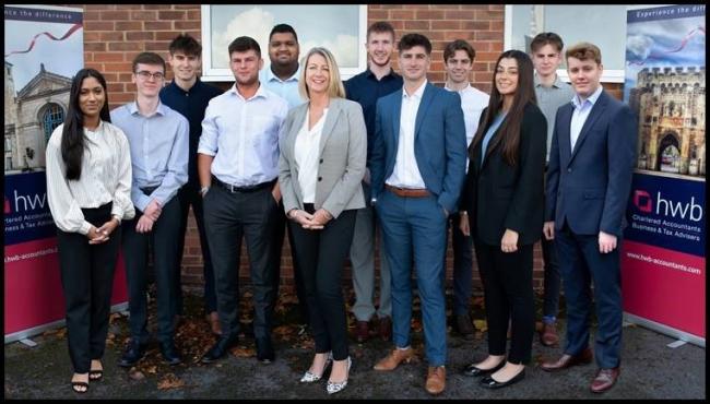 HWB operations director Tracy Jenkins (centre) with the new trainees which have just joined the firm.