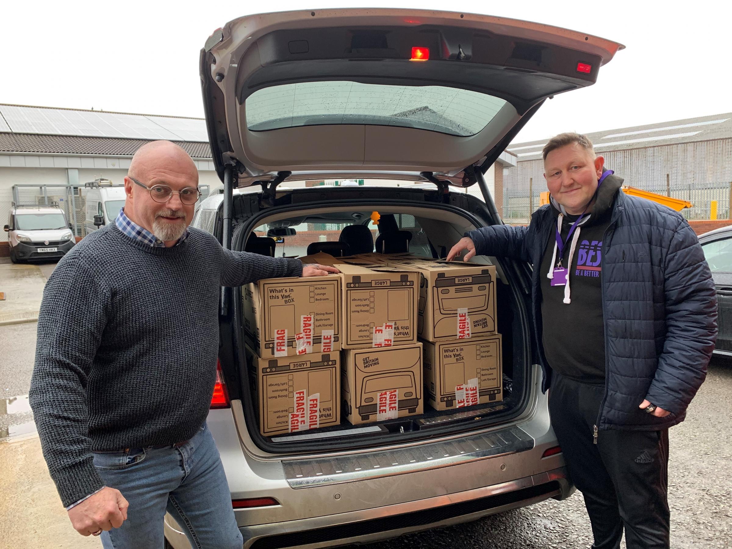 Don Bryden and Paul Rogers with the donated meals and presents for the BEST Christmas appeal
