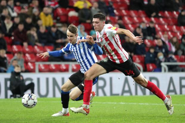 Ciaran Brennan (left) battles for the ball with Sunderland’s Ross Stewart during a League One game last season Photo: Richard Sellers