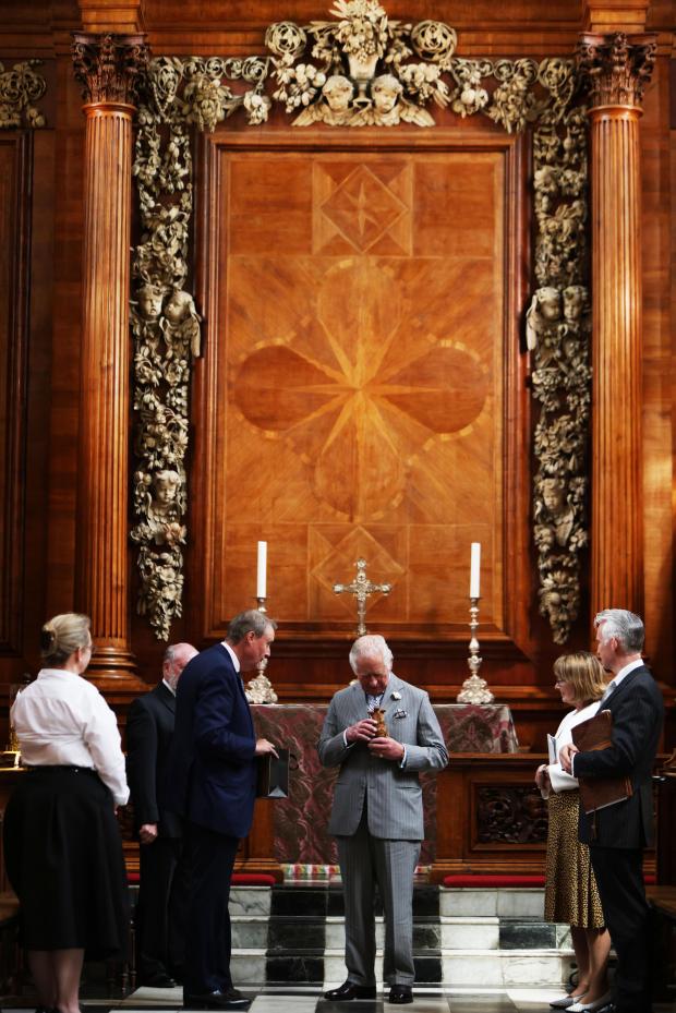 Swindon Advertiser: Prince Charles was shown the restored Grinling Gibbons Carvings at the College Chapel.