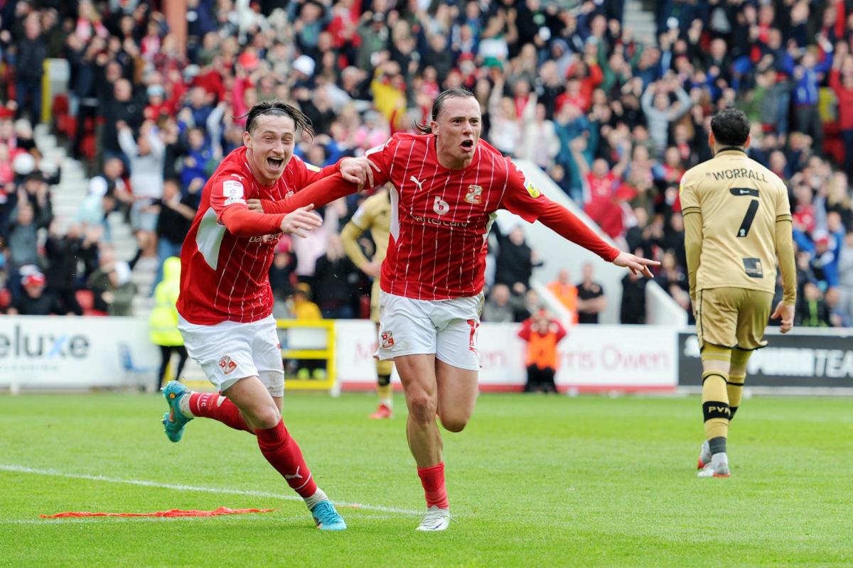 Swindon Town striker Harry McKirdy celebrates scoring his second goal against Port Vale last Sunday   Photo: Rob Noyes