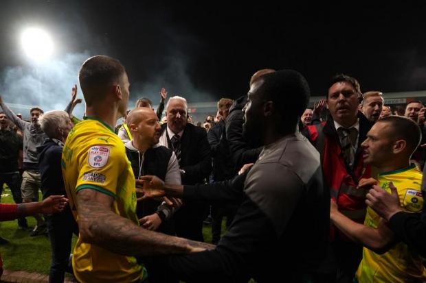 Town players are surrounded by Port Vale fans after the match. Photo: PA