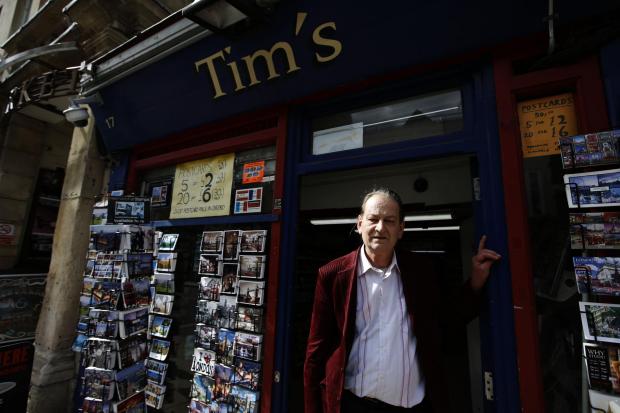 Tim Gresswell in front of Tim’s Newsagent and Off Licence on High Street. Picture: Ed Nix