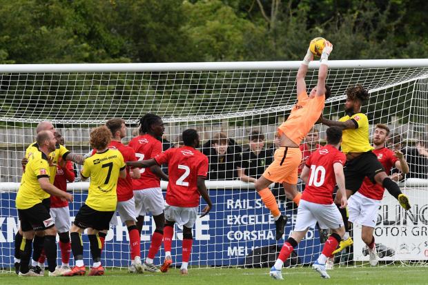 Swindon Town goalkeeper Sol Brynn catches a corner during the club’s pre-season friendly with Melksham Town on Saturday       Photo: Rob Noyes
