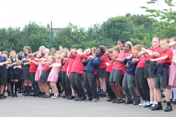 Swindon Advertiser: 900 pupils and staff members signed the song together
