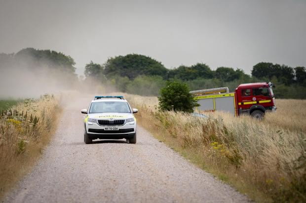 Swindon Advertiser: Soldiers pulled from a training exercise to help battle Salisbury Plain wildfires. Picture: SWNS