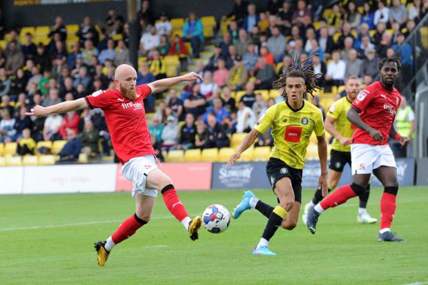 Swindon Town midfielder Jonny Williams fails to control a forward pass against Harrogate Town on Saturday     Photo: Rob Noyes