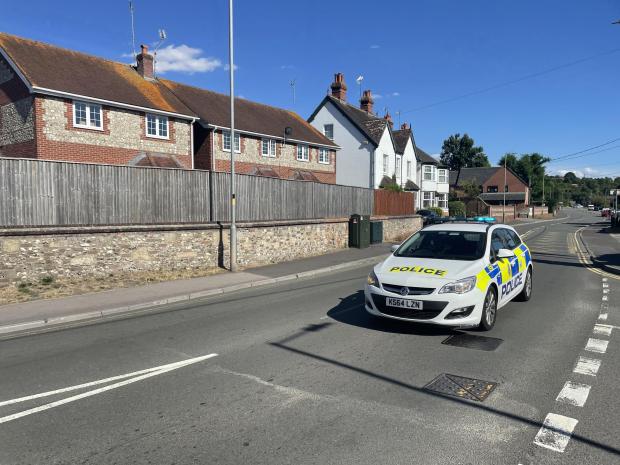Swindon Advertiser: A police car driving down Salisbury Road with its siren and lights on