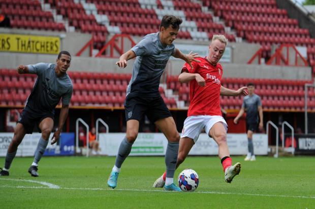Swindon Town striker Harry McKirdy chases down a Cardiff City defender in the Robins’ final pre-season friendly Photo: Rob Noyes