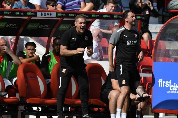 Swindon Town head coach Scott Lindsey (left) and assistant coach Gavin Gunning (right) against Salford City Photo: Rob Noyes