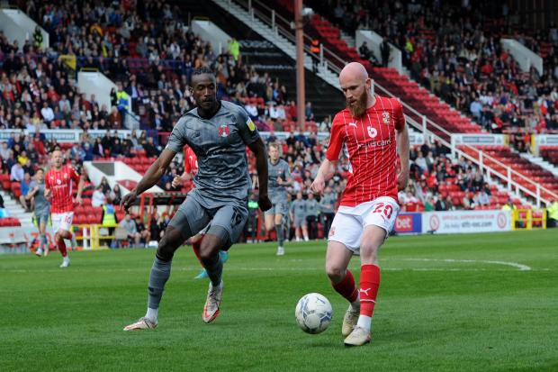 Jonny Williams tries to dribble away from Leyton Orient’s Omar Beckles during last season’s clash at the County Ground Photo: Rob Noyes