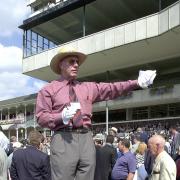 p 24/8/00  The old style bookies tic-tac man stands on a pile of boxes at York racecourse. Betting at York Races..