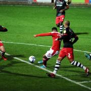 Tyler Smith shoots for Swindon Town against Exeter City in the 2020-21 EFL Trophy