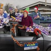 Jack Price from V Cars, Ian McCarthy from Swindon Nightshelter,  Diane Killick, Chairperson of Christmas Care, Swindon, and colleague John Davidson (C) HUW JOHN, Cardiff 02/12/2020