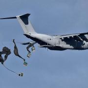 Nick Stinger Nett watched as a transport plane dropped supplies during military exercises on Salisbury Plain last week