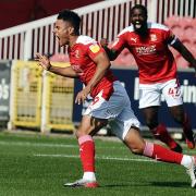 Tyler Smith celebrates scoring for Swindon Town against Rochdale on his Robins debut