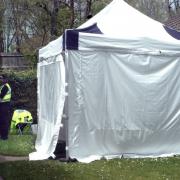 A tent erected outside a house in Fosse Way by police
