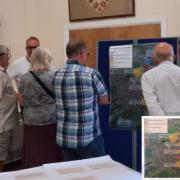Coun Gary Sumner, right, talks Wroughton residents through the proposals