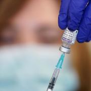 Nurse Heather Esmer draws a syringe before administering a Covid-19 vaccine booster at Birkenhead Medical Building in Birkenhead, Merseyside. Credit: PA