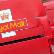 Two Royal Mail vans. Credit: PA