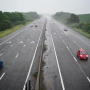 Cars driving on a motorway. Credit: PA