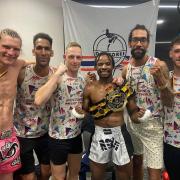 Members of Doctores Muay Thai gym in Swindon celebrate Aion McRae's British Featherweight Title victory