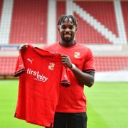 Tomi Adeloye becomes Swindon's third signing of the day. Photo: Swindon Town.