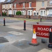 The road closed signs in Moredon Road, which is 'closed' but still open