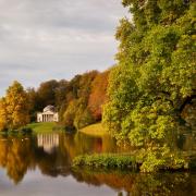 In autumn, a view across the lake to the Pantheon at Stourhead