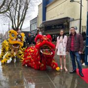 Hakka2 owner Christine Liaw welcomes the colourful lions into her restaurant to mark its grand opening.