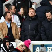 Swindon Town have provided an update on their assistant coach situation with manager Jody Morris (left) after Ed Brand (centre).