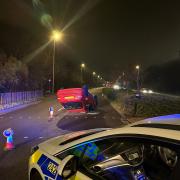 The red Honda Civic was left flipped over after the crash in Swindon.