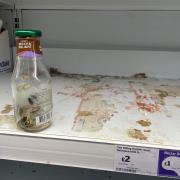The woman was sickened to see the state of the Sainsbury's shelf and empty bottle.