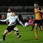 Derby County's Max Bird (left) and Newport County's Cameron Norman in action during the FA Cup second-round match at Rodney Parade last season