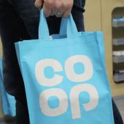 A Co-op shopper allegedly injured a member of staff and left with stolen goods