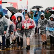 People in the rain at RIAT 2023