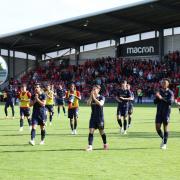 Swindon Town's players applaud the fans on their way off the pitch after Saturday's 5-5 draw with Wrexham