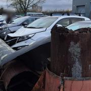 The chimney structure had snapped clean off its base, landing on four cars near the Jolly Roger