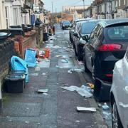 Rubbish strewn all over a street in central Swindon after Storm Isha