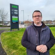 Cllr Daniel Adams is protesting Asda's move to cashless fuel stations in Swindon.
