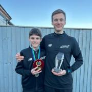Simon and Finley Byrne with their individual trophies