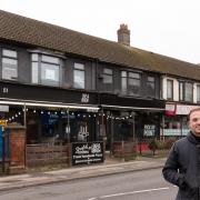 Arthur Dallimer outside the row of shops he wants to improve