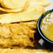Stock image of fish and chips with curry sauce