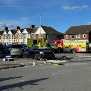 Emergency service vehicles filled County Road after two cars and a bus collided on a mini-roundabout