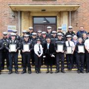 Police officers and senior staff pose with the High Sheriff of Wiltshire