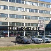 The new illuminated Infinity Motors sign has been given retrospective permission