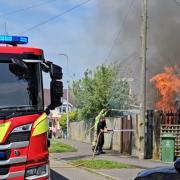 Firefighters kicked down a fence to tackle a blaze on Drove Road