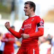 Elsnik celebrates scoring for Swindon